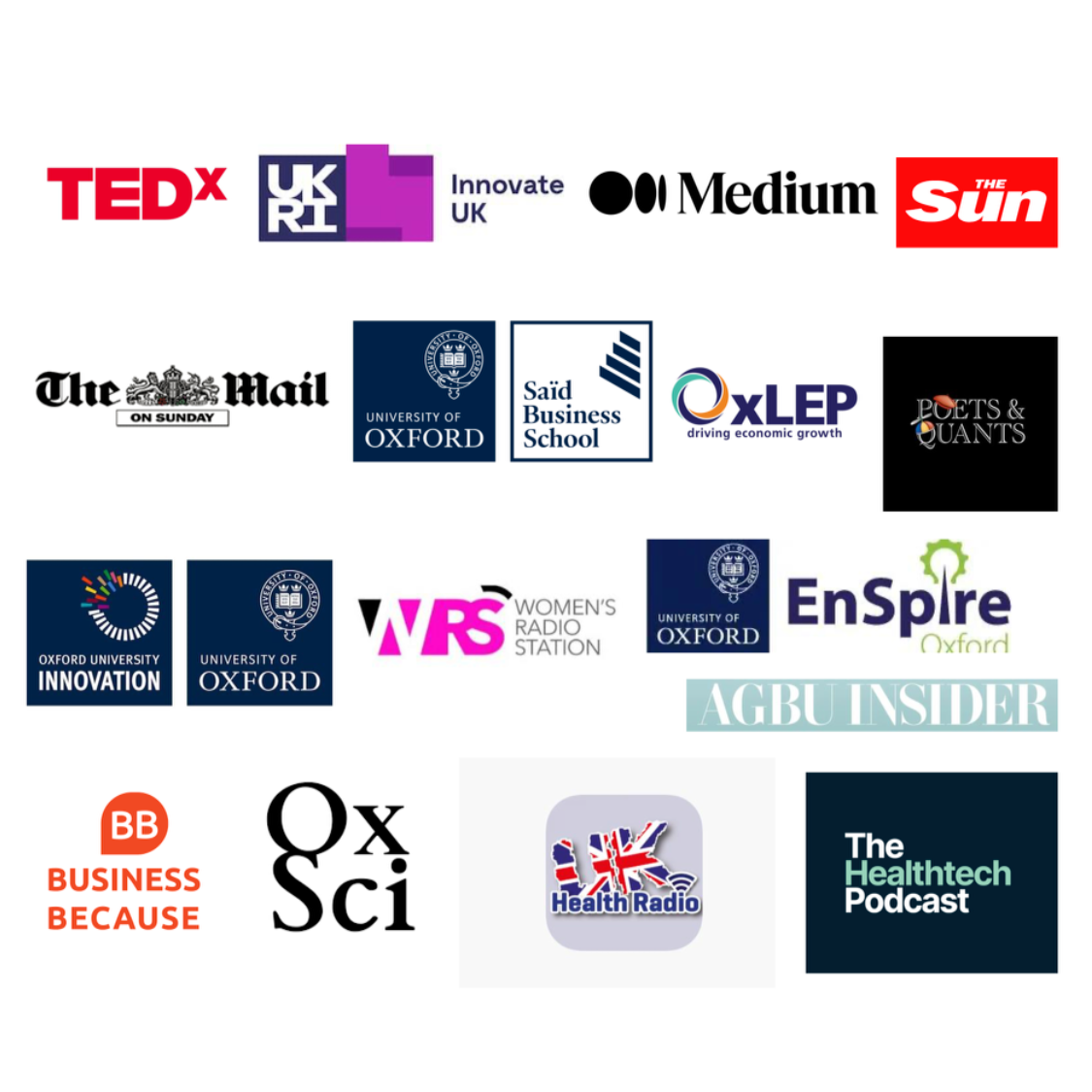 A woman with a scarf smiles while standing against a wall in a cafe setting.